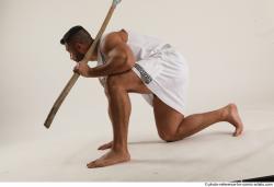 ATILLA KNEELING POSE WITH SPEAR